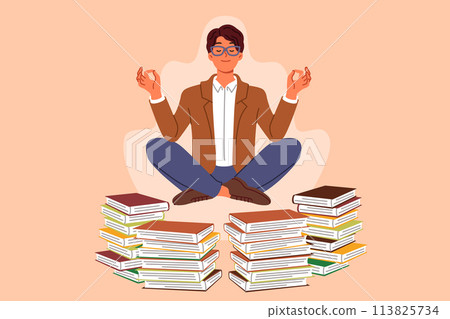Man does yoga and meditation, taking break from reading books, levitating in lotus position 113825734