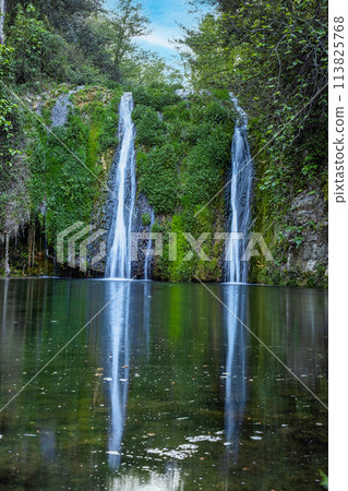 Beautiful waterfall in Spain in Catalonia, near the small village Les Planes de Hostoles 113825768