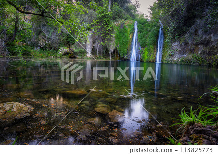 Beautiful waterfall in Spain in Catalonia, near the small village Les Planes de Hostoles Beautiful waterfall in Spain in Catalonia, near the small village Les Planes de Hostoles 113825773