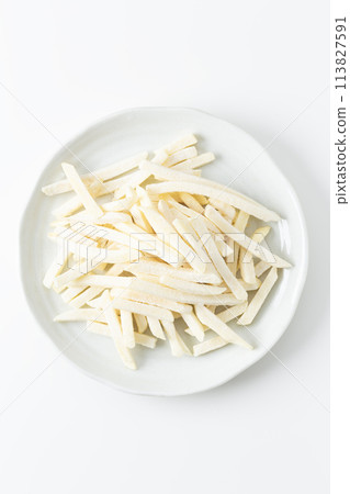 Frozen French fries on a white background Frozen French fries on a white background 113827591