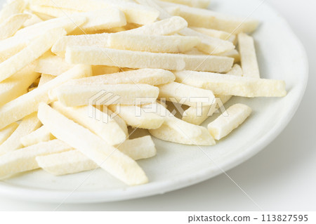 Frozen French fries on a white background Frozen French fries on a white background 113827595