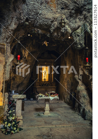 Catholic sanctuary in a old cave 113827614