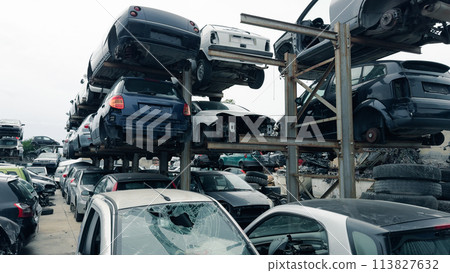stacked scrap cars. recovery of car components 113827632