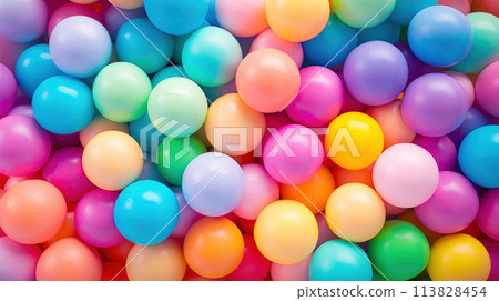 Many colorful bright soft balls background for kids playroom. Popular balloon zones in playgrounds. Childrens rainbow background 113828454