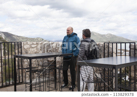 senior friends tourists outdoor adventure together on mediterranian sea landscape senior friends tourists outdoor adventure together on mediterranian sea landscape 113829378