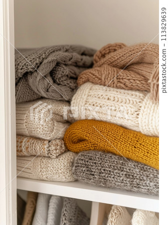Closet Filled With Sweaters and Blankets 113829639