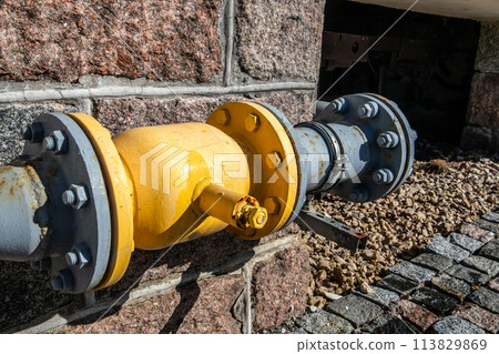 Yellow gas pipe on the wall of the building Yellow gas pipe on the wall of the building 113829869