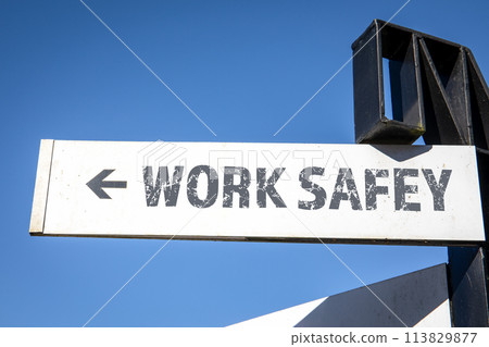 Work Safety. White signpost and blue sky Work Safety. White signpost and blue sky 113829877