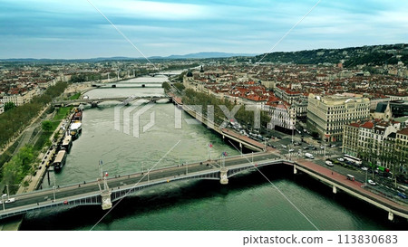 Aerial view of road traffic on bridges and the embankment of the River Rhone in Lyon, France 113830683