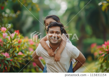 Father and Daughter Sharing a Joyful Moment in Warm Sunset Light 113831154