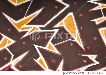 Colorful background of graffiti painting artwork with bright aerosol outlines on wall. Old school street art piece made with aerosol spray paint cans. Contemporary youth culture backdrop 113831372