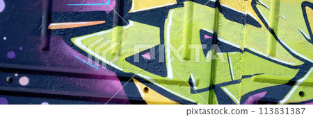Colorful background of graffiti painting artwork with bright aerosol outlines on wall. Old school street art piece made with aerosol spray paint cans. Contemporary youth culture backdrop 113831387