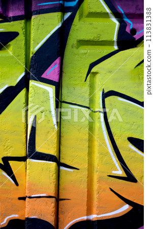 Colorful background of graffiti painting artwork with bright aerosol outlines on wall. Old school street art piece made with aerosol spray paint cans. Contemporary youth culture backdrop 113831388
