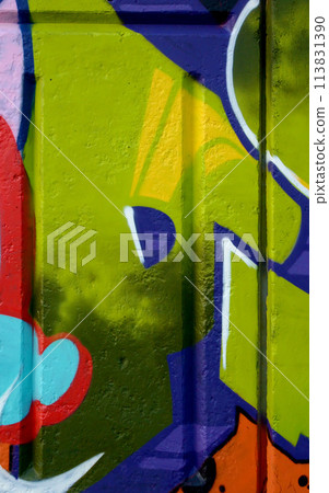 Colorful background of graffiti painting artwork with bright aerosol outlines on wall. Old school street art piece made with aerosol spray paint cans. Contemporary youth culture backdrop 113831390