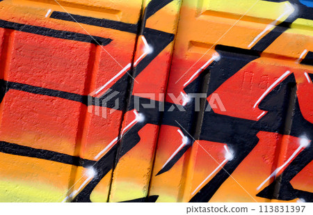 Colorful background of graffiti painting artwork with bright aerosol outlines on wall. Old school street art piece made with aerosol spray paint cans. Contemporary youth culture backdrop 113831397
