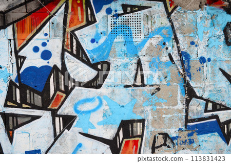 Colorful background of graffiti painting artwork with bright aerosol outlines on wall. Old school street art piece made with aerosol spray paint cans. Contemporary youth culture backdrop 113831423