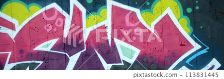 Colorful background of graffiti painting artwork with bright aerosol outlines on wall. Old school street art piece made with aerosol spray paint cans. Contemporary youth culture backdrop 113831445