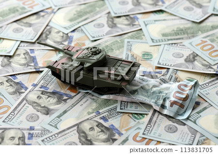 Tank on crumpled hundred dollar bills banknotes. Background of war funding and military support price for United States of America 113831705