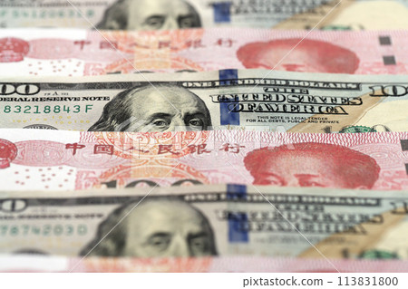 Many money bills of People Republic of China and United States. PRC Yuan and USD dollars banknotes close up Many money bills of People Republic of China and United States. PRC Yuan and USD dollars banknotes close up 113831800