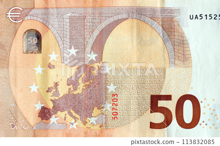 Fragment of one fifty euro money bill. Details of European union currency banknote of 50 euro close up Fragment of one fifty euro money bill. Details of European union currency banknote of 50 euro close up 113832085
