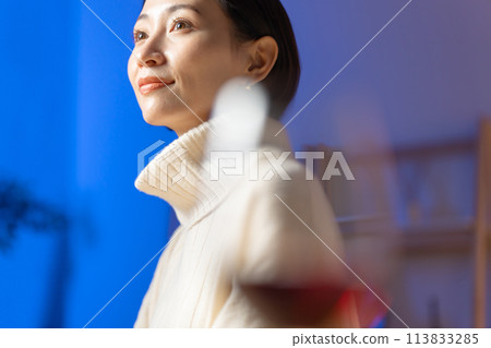 A woman drinking wine A woman drinking wine 113833285