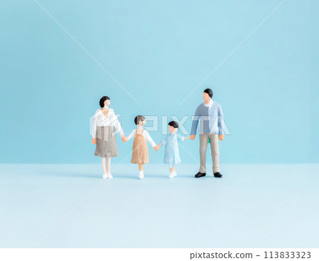Miniature family of four holding hands 113833323