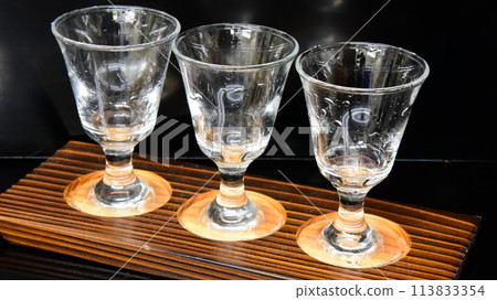 Traditional Japanese sake: 3 types of sake tasting in sake cup glasses Traditional Japanese sake: 3 types of sake tasting in sake cup glasses 113833354
