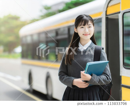 High school girl getting off the bus 113833706