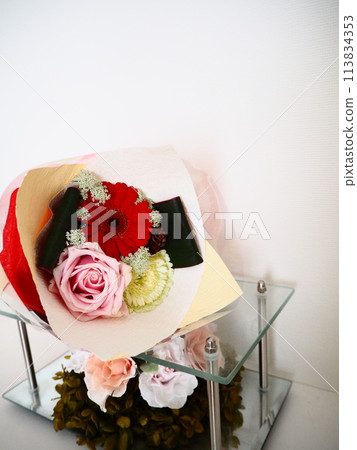 Cute bouquet of gerberas and roses Cute bouquet of gerberas and roses 113834353