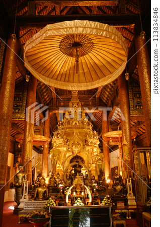 Luang Phor Phet, the principal Buddha image and beautiful Buddha statues that are hundreds of years old inside the chapel at Wat Phra That Chom Thong Worawihan. Located in Chiang Mai ,Thailand. 113834846