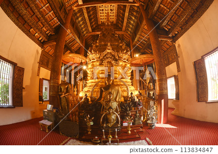Luang Phor Phet, the principal Buddha image and beautiful Buddha statues that are hundreds of years old inside the chapel at Wat Phra That Chom Thong Worawihan. Located in Chiang Mai ,Thailand. 113834847