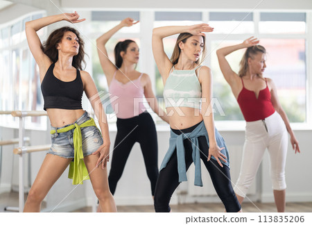 Group of women dancing high heels in studio 113835206