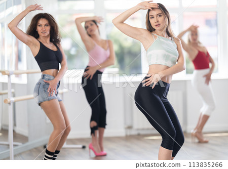 Young woman dancing high heels in group 113835266