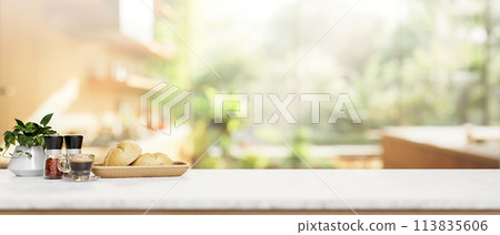 A white kitchen tabletop with a blurred background of a contemporary bright kitchen. 113835606