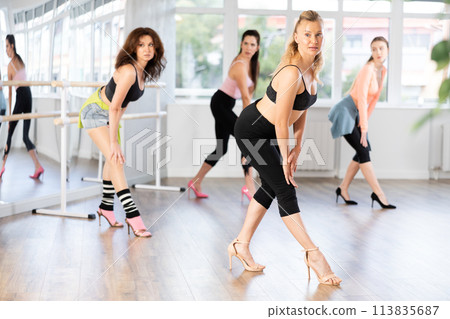 Adult woman dancing high heels in group 113835687