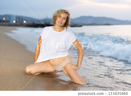 Sexy and beautiful woman in the beach next to sea 113835860