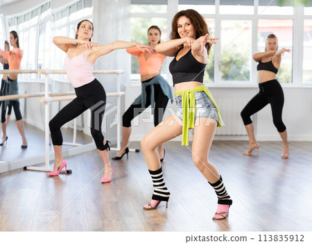 Group of women dancing high heels in studio 113835912