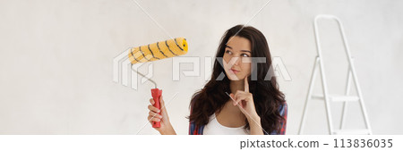 Thinking Painter Woman Portrait With Paint Roller on Unpainted Wall Thinking Painter Woman Portrait With Paint Roller on Unpainted Wall 113836035