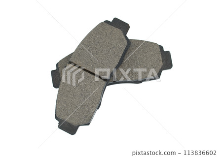 New auto brake pads isolated on white background New auto brake pads isolated on white background 113836602