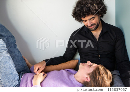 Tender Moment: Couple Enjoying a Relaxed Connection at Home 113837067