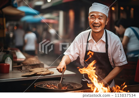 Happy Asian chef cooking traditional food on open fire in street market 113837534
