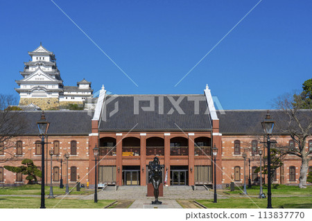 Himeji City Museum of Art and Himeji Castle tower against the blue sky Himeji City Museum of Art and Himeji Castle tower against the blue sky 113837770