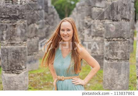 Beautiful tourist woman observing the old pyramid and temple of the castle of the Mayan architecture known as Chichen Itza these are the ruins of this ancient pre-columbian civilization and part of Beautiful tourist woman observing the old pyramid and temple of the castle of the Mayan architecture known as Chichen Itza these are the ruins of this ancient pre-columbian civilization and part of 113837801