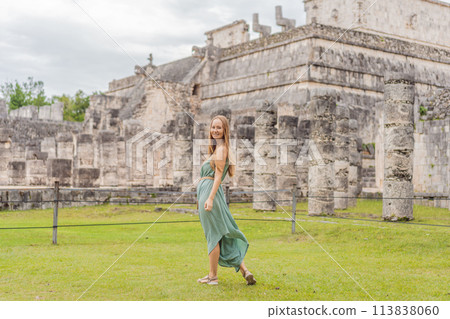 Beautiful tourist woman observing the old pyramid and temple of the castle of the Mayan architecture known as Chichen Itza these are the ruins of this ancient pre-columbian civilization and part of Beautiful tourist woman observing the old pyramid and temple of the castle of the Mayan architecture known as Chichen Itza these are the ruins of this ancient pre-columbian civilization and part of 113838060