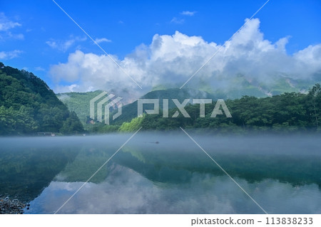 A fantastic view of Taisho Pond surrounded by morning mist @ Kamikochi, Nagano 113838233