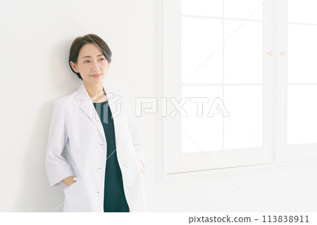 Portrait of a woman in a white coat Portrait of a woman in a white coat 113838911