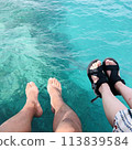 Sea and legs of men and women 113839584