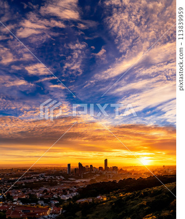 Illustration of silhouettes of buildings in the city center during magic hour 113839959
