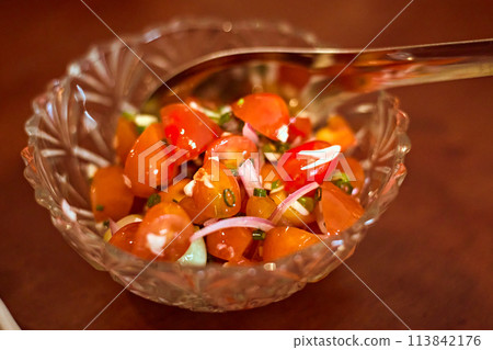 bowl of fresh tomato salsa. 113842176
