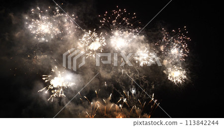 Golden Firework celebrate anniversary happy new year 2022, 4th of july holiday festival. Gold firework in the night time celebrate national holiday. Countdown to new year 2022 gold party time event Golden Firework celebrate anniversary happy new year 2022, 4th of july holiday festival. Gold firework in the night time celebrate national holiday. Countdown to new year 2022 gold party time event 113842244